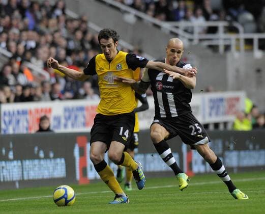 Radosav Petrovic of Blackburn Rovers (L) is tackled by Gabriel Obertan of Newcastle United. Newcastle United v Blackburn Rovers in the the FA Cup with Budweiser, 3rd round at The Sports Direct Arena, Newcastle upon Tyne 7th January, 2012 EDITORIAL USE ONLY. No use with unauthorised audio, video, data, fixture lists, club league logos or live services. Online in-match use limited to 120 images, no video emulation. No use in betting, games or single club league player publications.