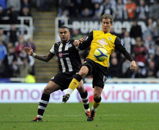 Danny Simpson (L) of Newcastle United is challenged by Morten Gamst Pedersen of Blackburn Rovers. Newcastle United v Blackburn Rovers in the the FA Cup with Budweiser, 3rd round at The Sports Direct Arena, Newcastle upon Tyne 7th January, 2012 EDITORIAL USE ONLY. No use with unauthorised audio, video, data, fixture lists, club league logos or live services. Online in-match use limited to 120 images, no video emulation. No use in betting, games or single club league player publications.