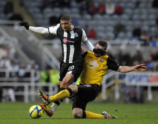 Leon Best of Newcastle United (L) is tackled by Grant Hanley of Blackburn Rovers. Newcastle United v Blackburn Rovers in the the FA Cup with Budweiser, 3rd round at The Sports Direct Arena, Newcastle upon Tyne 7th January, 2012 EDITORIAL USE ONLY. No use with unauthorised audio, video, data, fixture lists, club league logos or live services. Online in-match use limited to 120 images, no video emulation. No use in betting, games or single club league player publications.