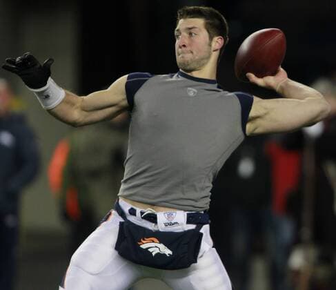 Denver Broncos quarterback Tim Tebow warms up before the AFC divisional playoff game against the New England Patriots at Gillette Stadium in Foxboro, Massachusetts on January 14, 2012.  BOS2012011401