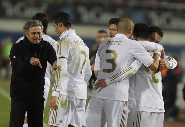 14.01.2012 Majorca, SPAIN - La Liga match played between Majorca and Real Madrid at Coliseum Iberostar stadium. Picture shows Jose Mourinho coach of Real Madrid, Cristiano Ronaldo (Real Madrid), Kepler Laveran Pepe (Real Madrid) and Jose Maria Callejon (Real Madrid) celebrating his team s goal xEFPx  ActionPlus11234192