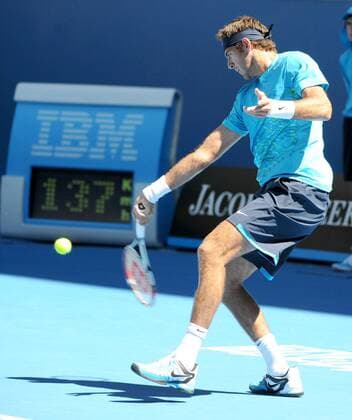 Juan Martin Del Potro of Argentina hits a return during the 1st round of men s singles match on day 1 of 2012 Australian Open tennis tournament at Melbourne Park 