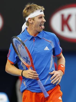 Australian Open 2012, Melbourne Park,ITF Grand Slam Tennis Tournament,Cedrik-Marcel Stebe (GER) ist verärgert und streckt die Zunge raus,Emotion,Einzelbild,Ganzkörper,Hochformat,