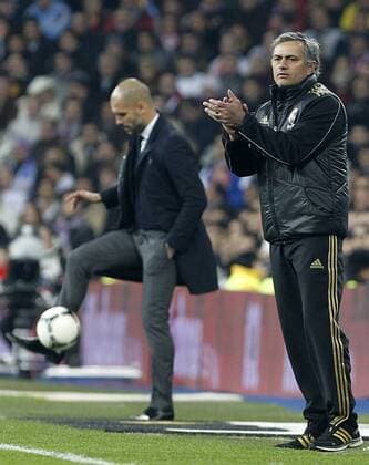 Real Madrid s Jose Mourinho (r) and FC Barcelona s coach Josep Pep Guardiola during Spanish King s Cup match.January 18,2011.  (201201182427)