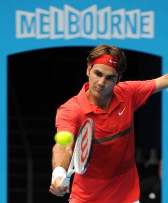 MELBOURNE, Jan. 20, 2012 -- Switzerland s Roger Federer hits a return in the third round men s singles match at 2012 Australian Open tennis championship in Melbourne, Australia, Jan. 20, 2012. 