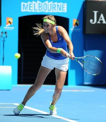 MELBOURNE, Jan. 22, 2012 -- Victoria Azarenka of Belarus hits a return during the women s singles match at the 2012 Australian Open tennis tournament in Melbourne, Australia, Jan. 22, 2012. 