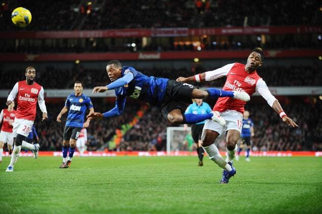 Football - Premier League - Arsenal vs. Manchester United Alex Song (Arsenal) Patrice Evra (Man Utd) 