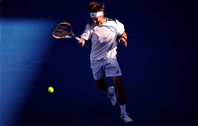 (120123) -- MELBOURNE, Jan. 23, 2012 (Xinhua) -- David Ferrer of Spain returns the ball during the fourth round match of men s singles at the Australian Open tennis tournament in Melbourne, Jan. 23, 2012. (Xinhua Chen Xiaowei)(wll) AUSTRALIA- MELBOURNE-TENNIS-AUSTRALIAN OPEN-DAY 8 