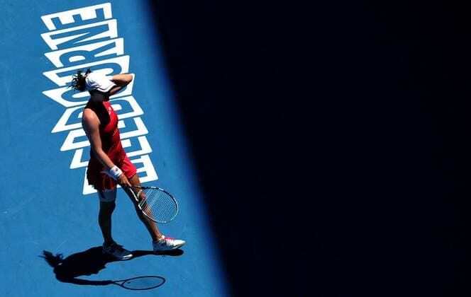 (120124) -- MELBOURNE, Jan. 24, 2012 (Xinhua) -- Agnieszka Radwanska of Poland reacts during the women s singles quarterfinal match at the 2012 Australian Open tennis tournament in Melbourne, Australia, Jan. 24, 2012. (Xinhua Chen Xiaowei) (jyc) AUSTRALIA-MELBOURNE-TENNIS-AUSTRALIAN OPEN-WOMEN S SINGLES 