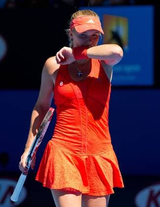 (120124) -- MELBOURNE, Jan. 24, 2012 (Xinhua) -- Caroline Wozniacki of Denmark reacts during the women s singles quarterfinal match at the 2012 Australian Open tennis tournament in Melbourne, Australia, Jan. 24, 2012. (Xinhua Bai Xue) (jyc) AUSTRALIA-MELBOURNE-TENNIS-AUSTRALIAN OPEN-WOMEN S SINGLES 