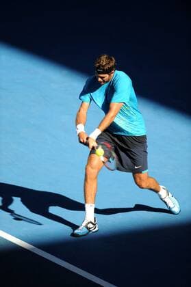 (120124) -- MELBOURNE, Jan. 24, 2012 (Xinhua) -- Juan Martin Del Potro of Argentina hits a return during the men s singles quarterfinals match at the 2012 Australian Open tennis tournament in Melbourne, Australia, Jan. 24, 2012. (Xinhua Guo Yong) (jyc) AUSTRALIA-MELBOURNE-TENNIS-AUSTRALIAN OPEN-MEN S SINGLES 