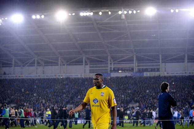 24.1.2012 Cardiff, Wales. Zaha (CP) player leaves the pitch devastated after their team loose in a penalty shootout during the Carling Cup Semi-Final second leg football match between Cardiff City and Crystal Palace at Cardiff City Stadium. xRoganxThomsonx  ActionPlus11238348