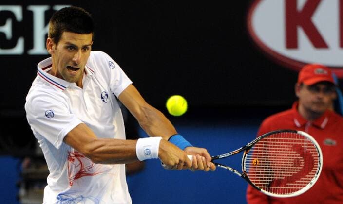 MELBOURNE, Jan. 29, 2012 -- Novak Djokovic of Serbia hits a return during their men s singles final at 2012 Australian Open tennis tournament in Melbourne on Jan. 29, 2012. (Xinhua Guo Yong) AUSTRALIA-MELBOURNE-TENNIS-MEN S-FINAL 