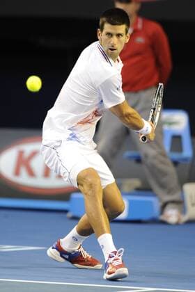 29.01.2012 Australian Open Tennis from Melbourne Park. Novak Djokovic (SRB) returns a shot in his match on the fourteenth day of the Australian Open Tennis Championships in Melbourne, Australia. xEstherxLimx  ActionPlus20215992