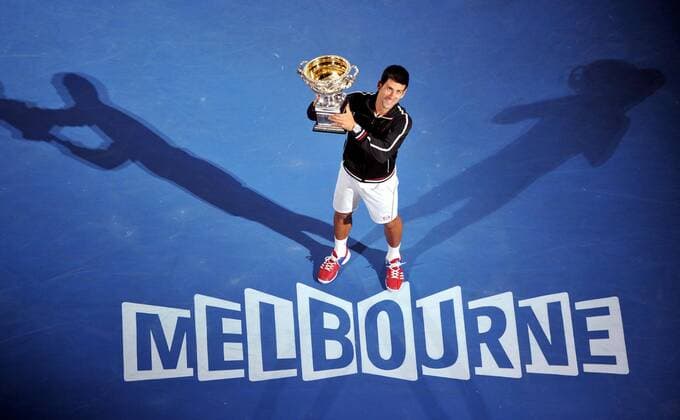 (120129) -- MELBOURNE, Jan. 29, 2012 (Xinhua) -- Novak Djokovic of Serbia poses with his trophy after winning the men s singles final at 2012 Australian Open tennis tournament in Melbourne, Australia, on Jan. 29, 2012. (Xinhua Chen Xiaowei) (hy) AUSTRALIA-MELBOURNE-TENNIS-MEN S-FINAL 