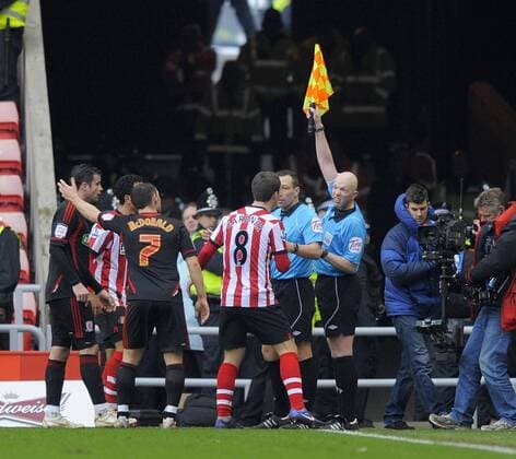 Middlesbrough and Sunderland players protest to referee Kevin Friend after the linesman puts his flag up for offside ruling out Craig Gardener s goal in the first half. The FA Cup with Budweiser match between Sunderland AFC vs Middlesbrough FC at the Stadium of Light at Sunderland on 29th January 2012 EDITORIAL USE ONLY. No use with unauthorised audio, video, data, fixture lists, club league logos or live services. Online in-match use limited to 120 images, no video emulation. No use in betting, games or single club league player publications.