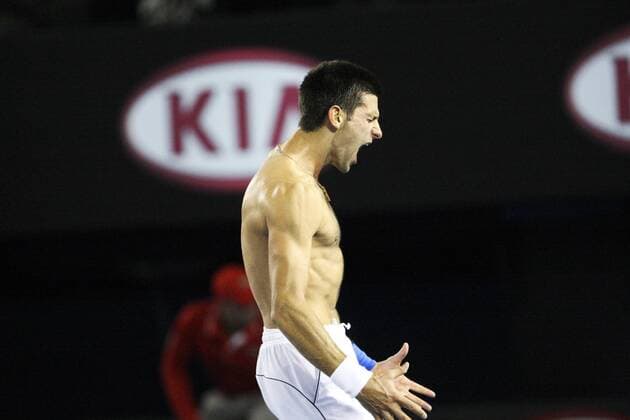 29 January 2012 : Novak Djokovic (SRB) in his final match against Rafael Nadal (ESP) with his shirt off after he ripped it shouts in celebration after winning the grandslam final during Day 14 of the Mens final of the Australian Tennis open grand slam event at Melbourne Park, Melbourne Australia. TENNIS: JAN 29 Australian Open - Men s Final Icon12012929 EDITORIAL USE ONLY
