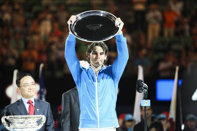 29 January 2012 : Rafael Nadal (ESP) in his final match against Novak Djokovic (SRB) holds up the runners up plate after losing during Day 14 of the Mens final of the Australian Tennis open grand slam event at Melbourne Park, Melbourne Australia. TENNIS: JAN 29 Australian Open - Men s Final Icon12012930 EDITORIAL USE ONLY