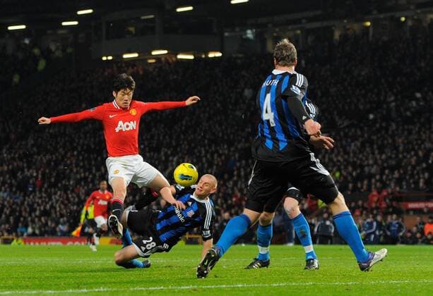 Park Ji-Sung of Manchester United is disposed by Andy Wilkinson of Stoke City.Barclays Premier League match between.Manchester United v Stoke City at the Old Trafford Stadium, Manchester on the 31st January 2012. EDITORIAL USE ONLY. No use with unauthorised audio, video, data, fixture lists, club league logos or live services. Online in-match use limited to 120 images, no video emulation. No use in betting, games or single club league player publications.