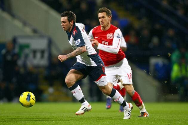 Football - Premier League - Bolton Wanderers vs. FC Arsenal Mark Davies of Bolton escapes FC Arsenal s Aaron Ramsey at the Reebok Stadium 