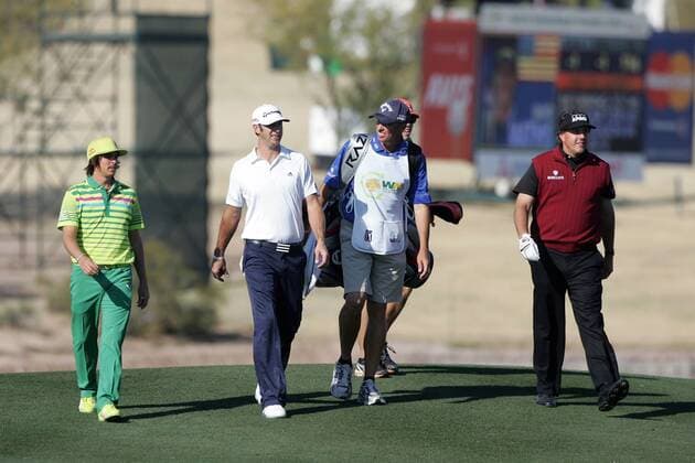 Feb. 2, 2012 - Scottsdale, Arizona, U.S - Phil Mickelson, Rickie Fowler and Dustin Johnson walk a fairway during the first round of the Waste Management Phoenix Open in Scottsdale, Arizona. PGA Golf Herren 2012 - Feb 2 - Waste Managment Phoenix Open - ZUMAx12
