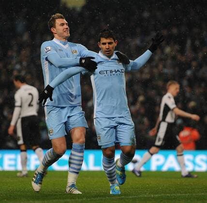 Manchester City s Sergio Kun Agüero celebrates scoring the opening goal with team-mate Edin Dzeko during the Premiership match at the Etihad Stadium. xHOCHxZWEIx xPropagandax
