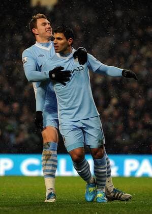 Manchester City s Sergio Kun Agüero celebrates scoring the opening goal with team-mate Edin Dzeko during the Premiership match at the Etihad Stadium. xHOCHxZWEIx xPropagandax