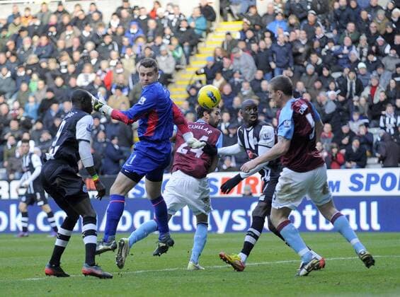 Shay Given of Aston Villa (2nd L) misses a cross which falls to team mate Richard Dunne.Barclays Premier League match between Newcastle United v Aston Villa at the Sports Direct Arena at Newcastle upon Tyne on 5th February 2012. EDITORIAL USE ONLY. No use with unauthorised audio, video, data, fixture lists, club league logos or live services. Online in-match use limited to 120 images, no video emulation. No use in betting, games or single club league player publications.