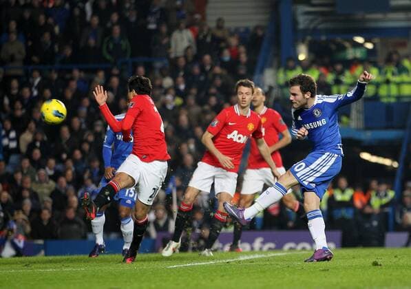 Chelseas Juan Mata scoring his sides second goal.- Chelsea FC London vs. Manchester United in the the Barclays Premier League at the Stamford Bridge, London. 5th February 2012. EDITORIAL USE ONLY. No use with unauthorised audio, video, data, fixture lists, club league logos or live services. Online in-match use limited to 120 images, no video emulation. No use in betting, games or single club league player publications.
