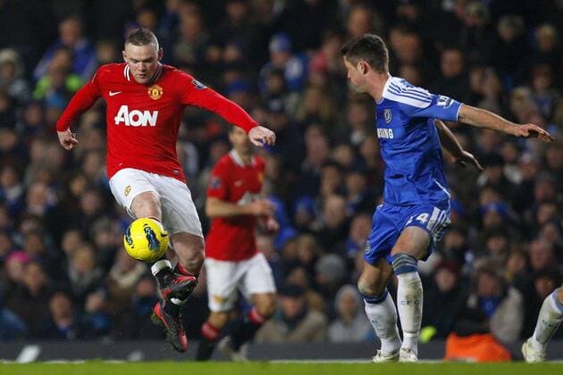 Wayne Rooney of Manchester United holds off Gary Cahill of Chelsea.Barclays Premier League - Chelsea FC London vs. Manchester United at Stamford Bridge, London.5th February, 2012. EDITORIAL USE ONLY. No use with unauthorised audio, video, data, fixture lists, club league logos or live services. Online in-match use limited to 120 images, no video emulation. No use in betting, games or single club league player publications.