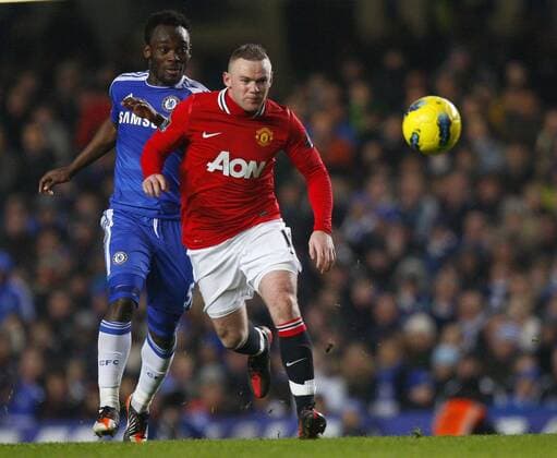 Wayne Rooney of Manchester United holds off Michael Essien of Chelsea.Barclays Premier League - Chelsea FC London vs. Manchester United at Stamford Bridge, London.5th February, 2012. EDITORIAL USE ONLY. No use with unauthorised audio, video, data, fixture lists, club league logos or live services. Online in-match use limited to 120 images, no video emulation. No use in betting, games or single club league player publications.