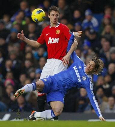 Fernando Torres of Chelsea holds off Jonny Evans of Manchester United.Barclays Premier League - Chelsea FC London vs. Manchester United at Stamford Bridge, London.5th February, 2012. EDITORIAL USE ONLY. No use with unauthorised audio, video, data, fixture lists, club league logos or live services. Online in-match use limited to 120 images, no video emulation. No use in betting, games or single club league player publications.