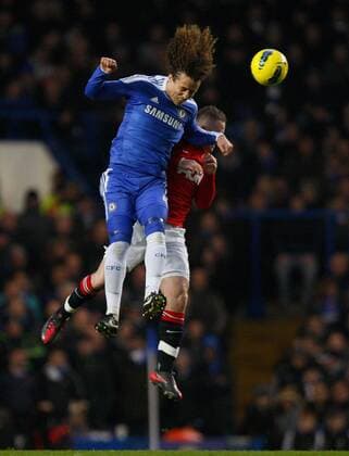 David Luiz of Chelsea and Wayne Rooney of Manchester United leap for the ball.Barclays Premier League - Chelsea FC London vs. Manchester United at Stamford Bridge, London.5th February, 2012. EDITORIAL USE ONLY. No use with unauthorised audio, video, data, fixture lists, club league logos or live services. Online in-match use limited to 120 images, no video emulation. No use in betting, games or single club league player publications.