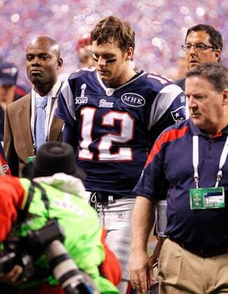 Feb. 5, 2012 - Indianapolis, IN, USA - Quarterback Tom Brady (12) of the New England Patriots leaves the field at the end of Super Bowl XLVI on Sunday, February 5, 2012, at Lucas Oil Stadium in Indianapolis, Indiana. The Giants defeated the Patriots, 21-17. Super Bowl XLVI - ZUMAm67