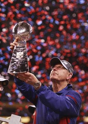 February 5, 2012 - Indianapolis, Ind. - New York Giants head coach Tom Coughlin hoists the Vince Lombardi Trophy after the Giants beat the New England Patriots 21-17 in Super Bowl XLVI at Lucas Oil Stadium in Indianapolis. NFL American Football Herren USA 2012: Super Bowl XLVI FEB 5 - ZUMAcr2