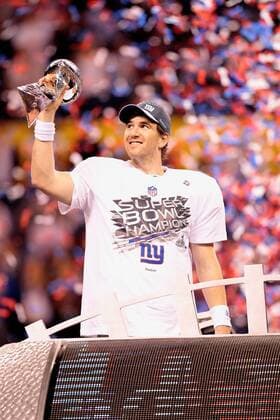 Feb. 5, 2012 - Indianapolis, IN, USA - Quarterback Eli Manning (10) of the New York Giants celebrates with the championship trophy at the end of Super Bowl XLVI on Sunday, February 5, 2012, at Lucas Oil Stadium in Indianapolis, Indiana. The Giants defeated the Patriots, 21-17. Super Bowl XLVI - ZUMAm67