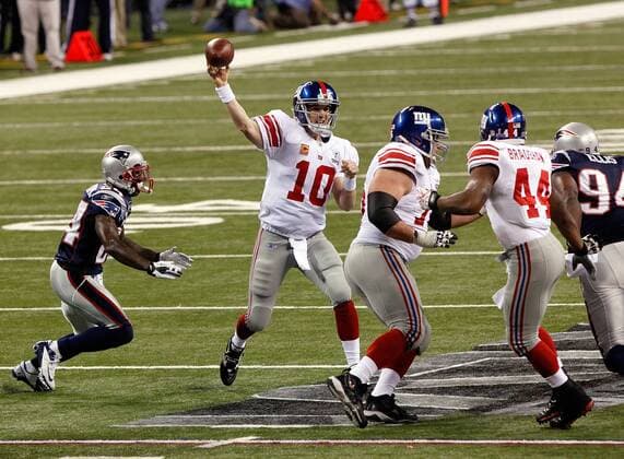Feb. 5, 2012 - Indianapolis, IN, USA - Quarterback Eli Manning (10) of the New York Giants makes a pass against the New England Patriots during first-quarter action of Superbowl XLVI on Sunday, February 5, 2012, at Lucas Oil Stadium in Indianapolis, Indiana. Super Bowl XLVI - ZUMAm67