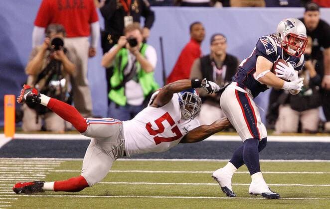 Feb. 5, 2012 - Indianapolis, IN, USA - Middle linebacker Jacquian Williams (57) of the New York Giants tried to hang on to running back Danny Woodhead (39) of the New England Patriots in second-quarter action of Superbowl XLVI on Sunday, February 5, 2012, at Lucas Oil Stadium in Indianapolis, Indiana. Super Bowl XLVI - ZUMAm67