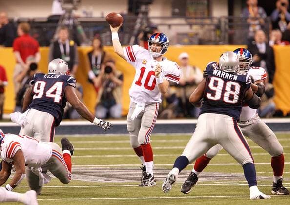 Feb. 5, 2012 - Indianapolis, IN, USA - Quarterback Eli Manning (10) of the New York Giants throws a pass against the New England Patriots in fourth-quarter action during Super Bowl XLVI on Sunday, February 5, 2012, at Lucas Oil Stadium in Indianapolis, Indiana. Super Bowl XLVI - ZUMAm67