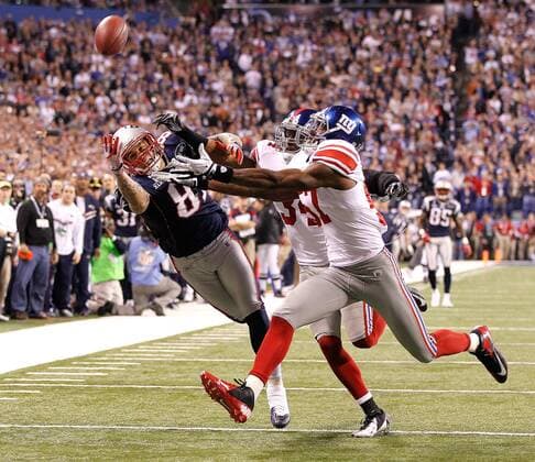 Feb. 5, 2012 - Indianapolis, IN, USA - Tight end Aaron Hernandez (81) of the New England Patriots was unable to catch this Tom Brady pass as he was defended by strong safety Deon Grant (34) of the New York Giants and middle linebacker Jacquian Williams (57) of the New York Giants late in the fourth quarter of Superbowl XLVI on Sunday, February 5, 2012, at Lucas Oil Stadium in Indianapolis, Indiana. The Giants defeated the Patriots, 21-17. Super Bowl XLVI - ZUMAm67