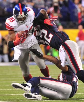 New York Giants wide receiver Hakeem Nicks (88) catches a 19-yard pass against the New England Patriots cornerback Devin McCourty and Antwaun Molden during the first quarter at Super Bowl XLVI at Lucas Oil Stadium on February 5, 2012 in Indianapolis. The NFC champion New York Giants play the AFC champion New England Patriots.  SBP20120205322