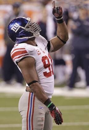 New York Giants defensive end Justin Tuck reacts late in the fourth quarter against the New England Patriots at Super Bowl XLVI at Lucas Oil Stadium on February 5, 2012 in Indianapolis. New York beat New England 21-17 to win Super Bowl XLVI.  SBP20120205504