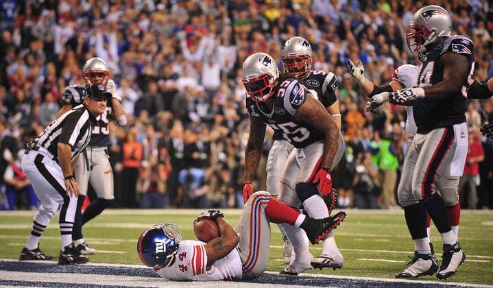 New York Giants running back Ahmad Bradshaw scores the game-winning touchdown on a 6-yard run in the fourth quarter against the New England Patriots at Super Bowl XLVI at Lucas Oil Stadium on February 5, 2012 in Indianapolis. The Giants beat the Patriots 21-17 to win Super Bowl XLVI..  SBP20120205380