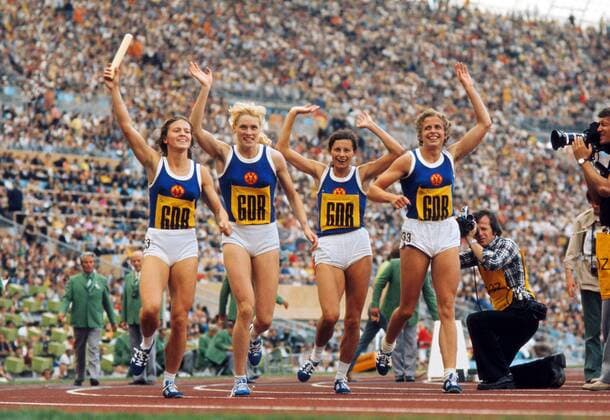 Munich Olympics 1972 Womens 4 x 400M Relay Final winners East German team celebrate. L to R . Monika Zehrt, Rita Kühne, Helga Seidler, Dagmar Käsling. 