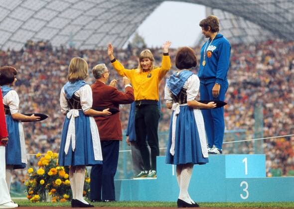 Munich Olympics 1972 Womens 200m Final Presentation. Raelene Boyle - Australia, salutes the crowd on receiving her Silver medal. Renate Stecher - East Germany (right) Gold medal - 