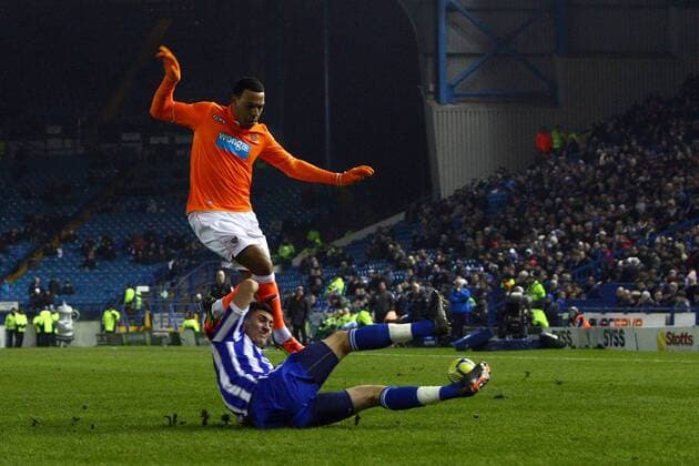 Football - FA Cup Fourth Round Replay - Sheffield Wednesday vs. Blackpool Wednesday s Danny Batth challenges Blackpool s Matt Phillips at Hillsborough 