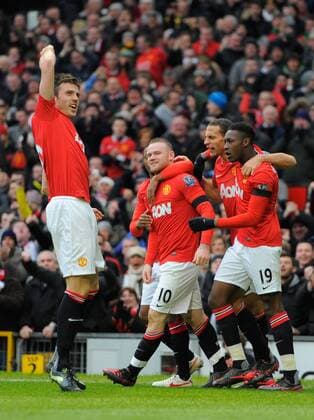 Wayne Rooney of Manchester United celebrates scoring the second goal as Michael Carrick of Manchester United leads the celebrations.Barclays Premier League.Manchester United v Liverpool at Old Trafford, Manchester on the 11th February 2012 - EDITORIAL USE ONLY. No use with unauthorised audio, video, data, fixture lists, club league logos or live services. Online in-match use limited to 120 images, no video emulation. No use in betting, games or single club league player publications.