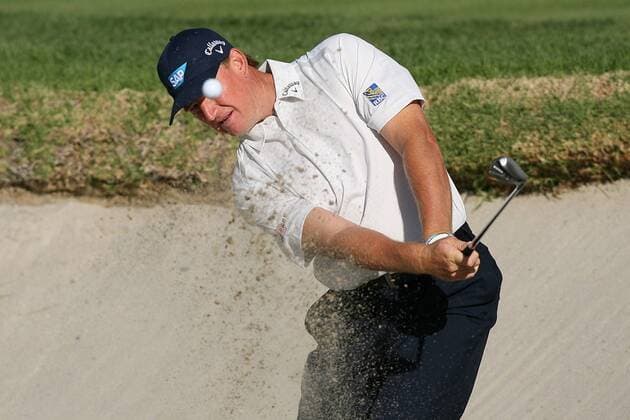 Feb. 18, 2012 - Pacific Palisades, California, U.S. - 02 18 12 Pacific Palisades, CA: Keeping his eye on the ball. Ernie Els hits out of a greenside bunker on the first hole during the third round of the Northern Trust Open held at the Riviera Country Club 2 18 12 Northern Trust Open Third Round - ZUMAec2