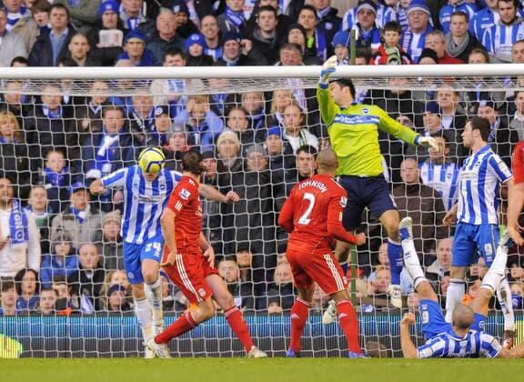 Glen Johnson of Liverpool heads the ball for the second goal..The FA Cup with Budweiser 5th Round match between.Liverpool FC vs Brighton & Hove Albion at Anfield, Liverpool on the .19th February 2012. EDITORIAL USE ONLY. No use with unauthorised audio, video, data, fixture lists, club league logos or live services. Online in-match use limited to 120 images, no video emulation. No use in betting, games or single club league player publications.
