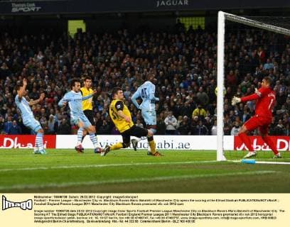 Football - Premier League - Manchester City vs. Blackburn Rovers Mario Balotelli of Manchester City opens the scoring at the Etihad Stadium 